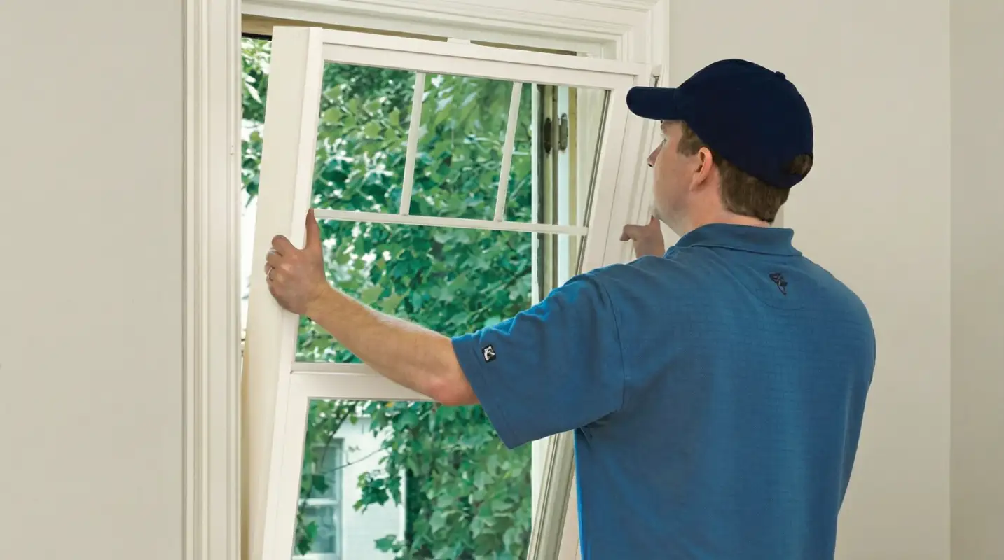 Professional contractors performing a residential window insulation and replacement service in Pembroke Pines, FL